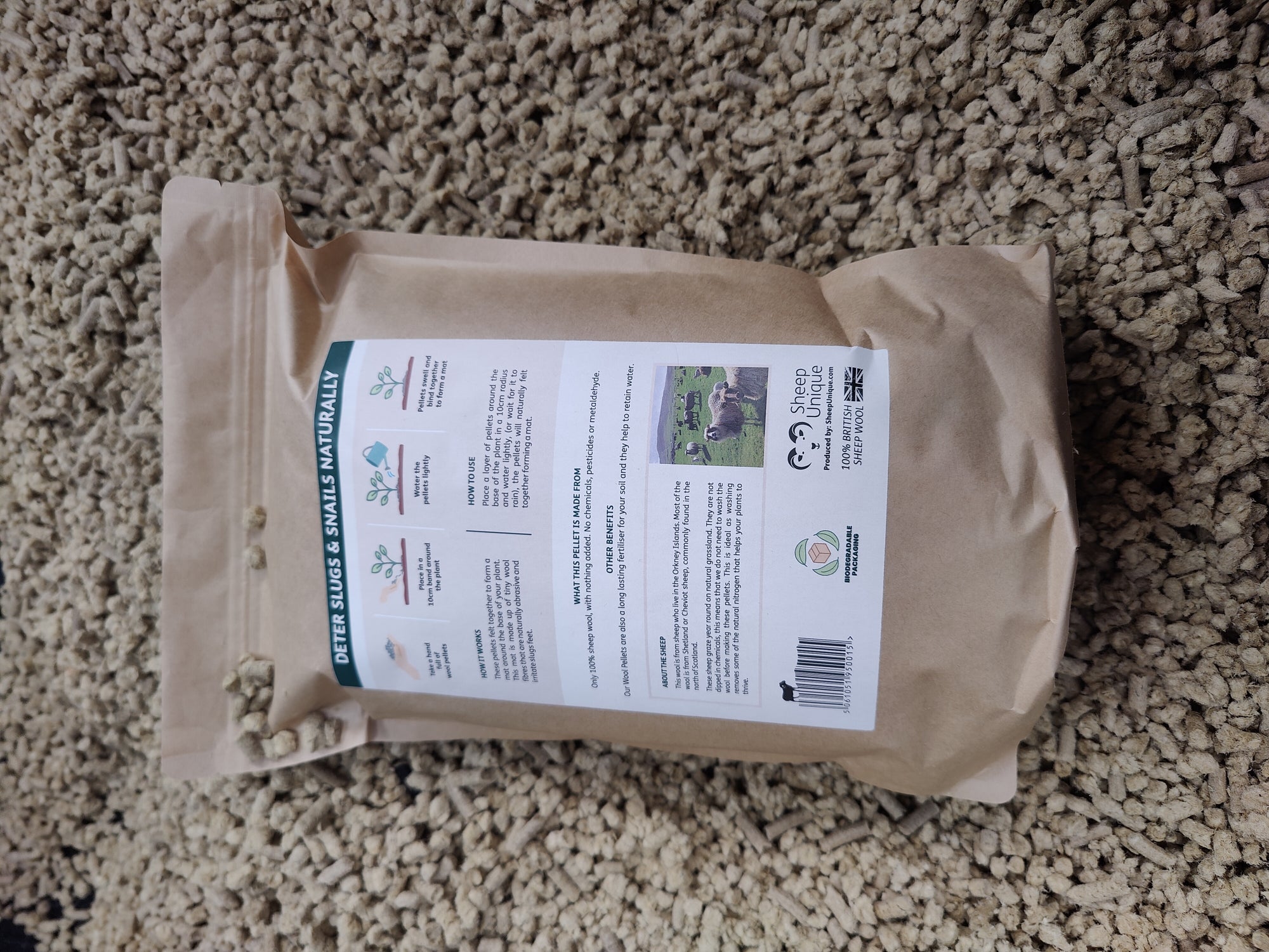 The back of the bag, showing a little photo of our sheep. The background of the photo is more pellets.