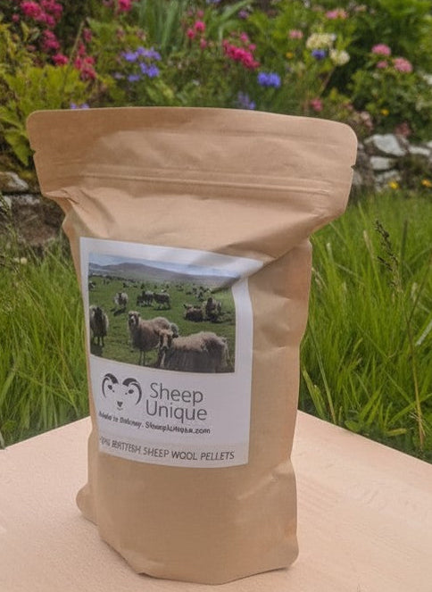 Bag of 'Sheep Unique' product on a wooden block with a garden background