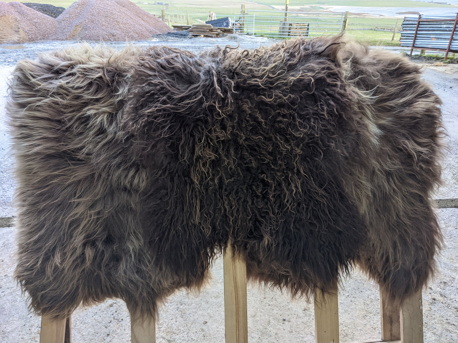 3 Brown Sheepskin Rugs side by side showing variation in texture